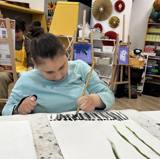 Alissa doing artwork